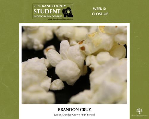 Close up of popcorn on a black floor